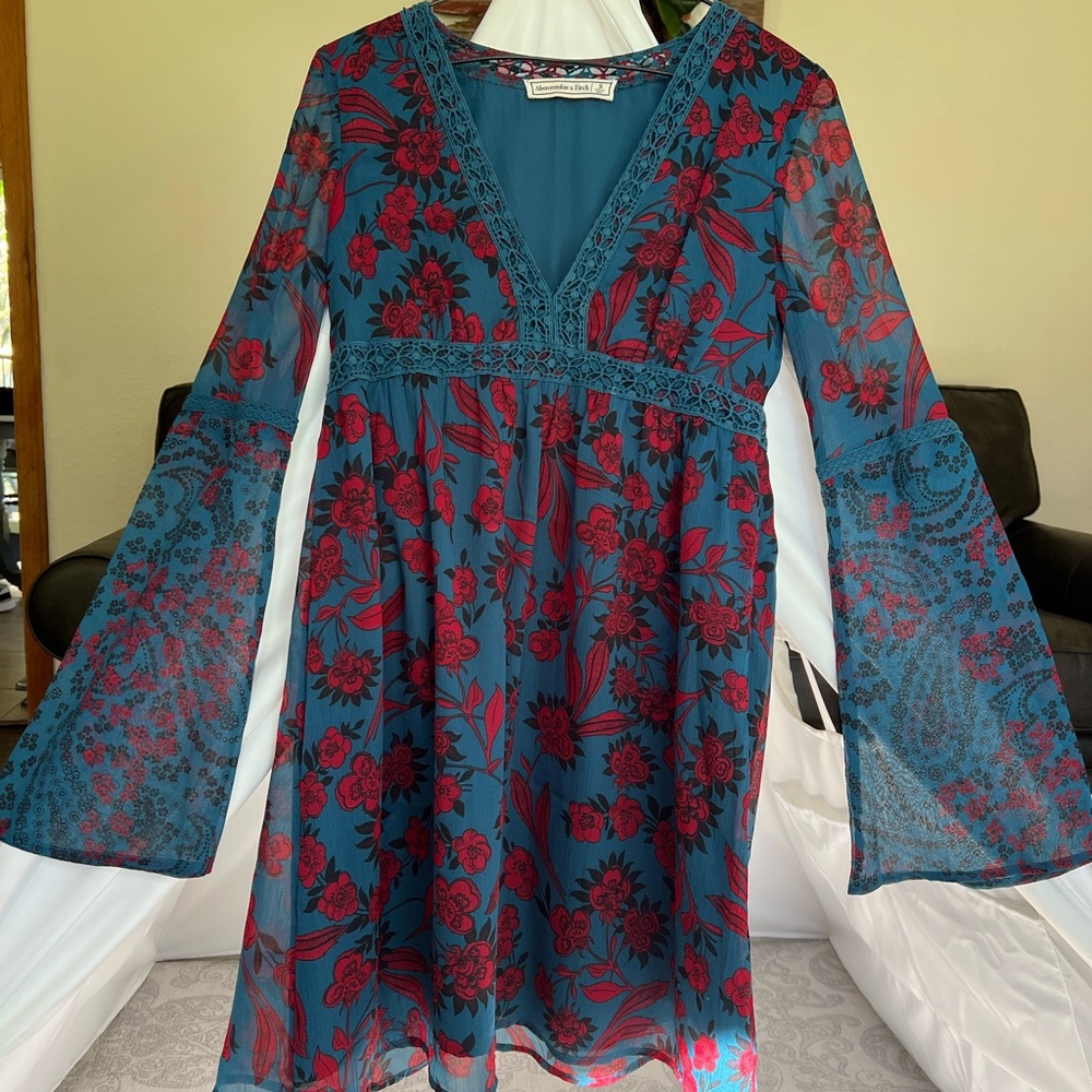Jewel toned floral bell sleeve dress with lace detail